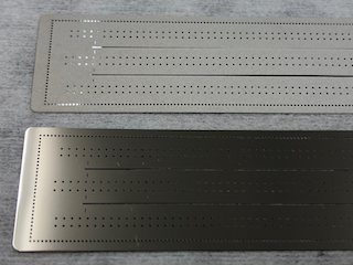 Close-up on large Ni nozzle-plates, micropatterned conical spray orifices